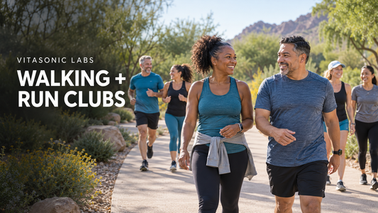 Vitasonic Labs walking and run clubs banner showing a diverse group walking and jogging together on a park path.